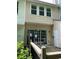 A back porch features sliding glass doors with access to the home's interior at 211 Buckland Dr, Alpharetta, GA 30022