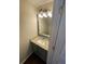 Bathroom boasts granite vanity, framed mirror, and modern lighting at 211 Buckland Dr, Alpharetta, GA 30022
