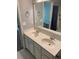 Bathroom featuring double sinks, tile floors, a large mirror, and white cabinets at 211 Buckland Dr, Alpharetta, GA 30022