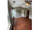 Bright bedroom with wood floors, a ceiling fan, neutral walls, and a walk-in closet at 211 Buckland Dr, Alpharetta, GA 30022
