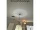 A smooth ceiling with modern light fixtures complements the sleek interior design of the space at 211 Buckland Dr, Alpharetta, GA 30022