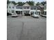 A row of townhomes with parking and landscaping offers suburban living convenience and charm at 211 Buckland Dr, Alpharetta, GA 30022