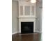 Classic fireplace with white mantel and built-in shelving that offers a cozy focal point at 211 Buckland Dr, Alpharetta, GA 30022