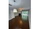 Bright living room with modern lighting and hardwood floors, complete with a fireplace feature at 211 Buckland Dr, Alpharetta, GA 30022