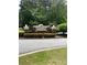 The brick signage marks the entrance to the Devonshire community at 211 Buckland Dr, Alpharetta, GA 30022