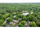 Aerial view of lakeside community with lush greenery, highlighting the scenic surroundings at 448 Teal Ct, Roswell, GA 30076