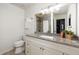 Updated bathroom features granite countertop, soft lighting, and shower/tub combo at 448 Teal Ct, Roswell, GA 30076