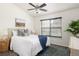 Bright bedroom with ceiling fan, modern rug, and large window views at 448 Teal Ct, Roswell, GA 30076