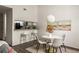 Charming dining area next to the kitchen, featuring modern decor and a stylish pendant light at 448 Teal Ct, Roswell, GA 30076