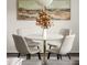 Close-up of a modern dining table, four stylish chairs, and contemporary decor at 448 Teal Ct, Roswell, GA 30076