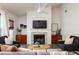 Bright living room showcasing a fireplace, neutral walls, and a modern ceiling fan at 448 Teal Ct, Roswell, GA 30076