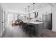 Bright kitchen features stainless steel appliances, a large island with barstool seating, and an adjacent dining area at 507 Motivation Nw Cir, Atlanta, GA 30309
