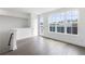Bright living room featuring hardwood floors, large windows, and plenty of natural light at 507 Motivation Nw Cir, Atlanta, GA 30309