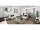 Cozy living room with neutral furniture, modern art, and an open layout, seamlessly connecting to the kitchen and dining area at 507 Motivation Nw Cir, Atlanta, GA 30309