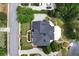 Luxury brick home with manicured landscaping boasts a spacious rooftop and private water access at 5070 Riverlake Dr, Peachtree Corners, GA 30097