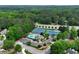 Community amenities include tennis courts and a pool, offering an active lifestyle surrounded by lush greenery at 5070 Riverlake Dr, Peachtree Corners, GA 30097
