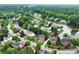 Lakeside homes showcase established landscaping and peaceful waterfront views, creating an idyllic neighborhood at 5070 Riverlake Dr, Peachtree Corners, GA 30097
