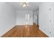 Bright bedroom with hardwood floors and a ceiling fan, offering a comfortable space at 5070 Riverlake Dr, Peachtree Corners, GA 30097