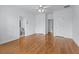 A bedroom with hardwood floors, with a view of a bathroom and closet at 5070 Riverlake Dr, Peachtree Corners, GA 30097