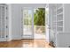 Bright den with built-in bookshelves and outdoor access at 5070 Riverlake Dr, Peachtree Corners, GA 30097