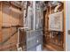 View of a furnace room, including ductwork and water heater at 5070 Riverlake Dr, Peachtree Corners, GA 30097