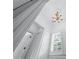 Upstairs hallway showcases decorative ceiling and fixtures, and shuttered window at 5070 Riverlake Dr, Peachtree Corners, GA 30097
