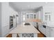 Gourmet kitchen with granite countertops, stainless steel appliances, and a large center island at 5070 Riverlake Dr, Peachtree Corners, GA 30097