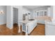 Well-appointed kitchen with a large island, stainless steel appliances, and custom cabinetry at 5070 Riverlake Dr, Peachtree Corners, GA 30097
