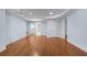 Large finished basement living area featuring hardwood floors and several entrances at 5070 Riverlake Dr, Peachtree Corners, GA 30097