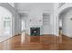 Open-concept living area featuring a fireplace, hardwood floors, and a seamless flow at 5070 Riverlake Dr, Peachtree Corners, GA 30097