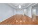 Spacious living room with hardwood floors, tray ceiling, and recessed lighting at 5070 Riverlake Dr, Peachtree Corners, GA 30097