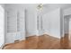 Office with hardwood floors and built-in bookshelves at 5070 Riverlake Dr, Peachtree Corners, GA 30097