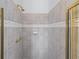 Shower stall features decorative tile surround and brass shower fixtures at 5070 Riverlake Dr, Peachtree Corners, GA 30097