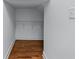 Walk in storage closet featuring hardwood floors and white walls at 5070 Riverlake Dr, Peachtree Corners, GA 30097