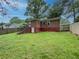 Spacious backyard featuring lush green grass and a fenced perimeter at 646 Quillian Ave, Decatur, GA 30032