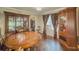 Dining area featuring hardwood floors and a dark wood China cabinet at 646 Quillian Ave, Decatur, GA 30032
