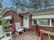 Close up of a brick home's front porch with rocking chairs at 646 Quillian Ave, Decatur, GA 30032
