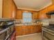 Bright kitchen with stainless steel appliances and oak cabinets at 646 Quillian Ave, Decatur, GA 30032