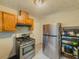 Functional kitchen featuring stainless steel appliances and wood cabinets at 646 Quillian Ave, Decatur, GA 30032