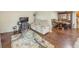 Spacious living room with hardwood floors, modern furniture, and adjoining dining area at 646 Quillian Ave, Decatur, GA 30032