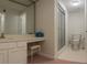 Bathroom featuring vanity with stool, a mirror, and a shower with glass door at 802 Lismore Se # 2, Smyrna, GA 30080