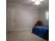 Bedroom with a blue coverlet and chair, ready for personalization and relaxation at 802 Lismore Se # 2, Smyrna, GA 30080