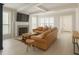 Bright living room featuring a fireplace, hardwood floors, and a comfortable brown leather sofa at 802 Lismore Se # 2, Smyrna, GA 30080