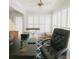 Bright home office space featuring an executive chair, shutters, and a cozy rug at 802 Lismore Se # 2, Smyrna, GA 30080
