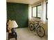 A cozy patio with a decorative green wall, natural light, and a bicycle at 802 Lismore Se # 2, Smyrna, GA 30080