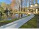 Scenic pond with a gazebo, fountain, and a paved walking path in a serene setting at 802 Lismore Se # 2, Smyrna, GA 30080