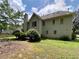 Spacious backyard featuring a well-maintained lawn and mature trees, perfect for outdoor activities and relaxation at 3419 White Sands Way, Suwanee, GA 30214