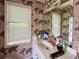 Bathroom featuring world map wallpaper, large window and vanity area at 3419 White Sands Way, Suwanee, GA 30214