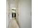 Hallway view of laundry room with modern washer and dryer at 3419 White Sands Way, Suwanee, GA 30214