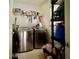 Well-equipped laundry room with modern washer, dryer, and storage at 3419 White Sands Way, Suwanee, GA 30214